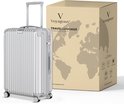 Zilveren Voyagoux reiskoffer met gesloten handvat, naast een doos met wereldkaart.