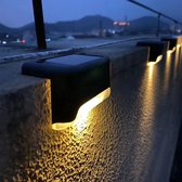 Meisterhome Éclairage LED Solar pour marche d'escalier capteur jour et nuit sur l'énergie solaire - IP65 Etanche - 4 pièces - Éclairage de jardin - Blanc chaud - Énergie solaire - Pour Escabeaux, murs, allées - Terrasse
