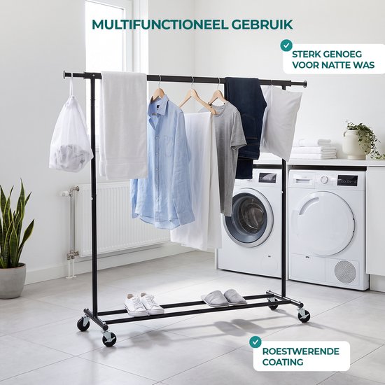 Zwart kledingrek in een wasruimte met handdoeken, kleding en wasmachines. Sterk genoeg voor natte was, met roestwerende coating.
