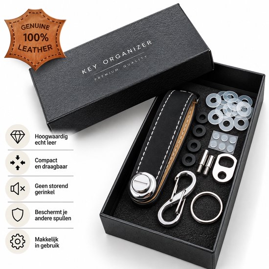 Zwarte sleutelorganizer van 100% echt leer, met zilveren gesp en karabijnhaak, in een zwarte geschenkdoos met accessoires.