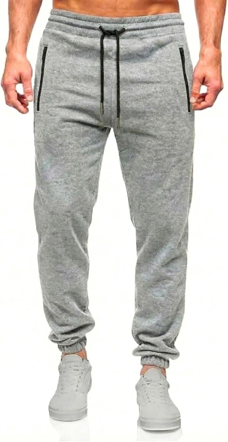 Trainingsbroek voor Heren. Lange Trainingsbroek. Elastische Trainingsbroek met Verstelbaar Koord en Zakken met Ritssluiting.