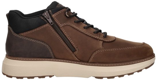 Bruine leren Rieker schoen met ritssluiting, beige zool en zwarte accenten.