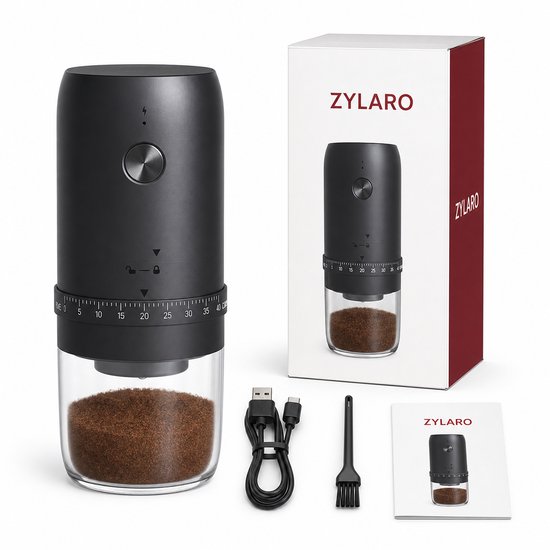 ZYLARO elektrische koffiemolen met glazen opvangbak, USB-kabel en borstel op verpakking.