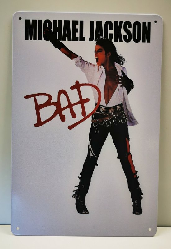 Michael Jackson pose avec un bras levé, texte 'BAD' en rouge.