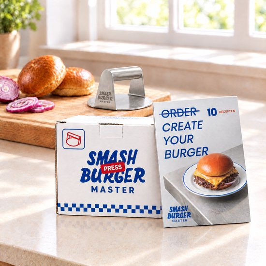 Roestvrijstalen Smashburger Master pers met verpakking en receptenboekje op een aanrecht met hamburger ingrediënten.