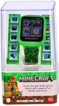 Groene Minecraft smartwatch met touchscreen en camerabediening in doorzichtige verpakking.