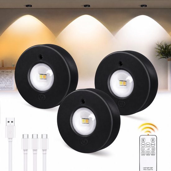 Drie zwarte ronde led lampjes met usb oplaadkabels en afstandsbediening.