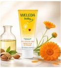 Tube Weleda billenbalsem met bloemen, mandarijn en amandelen.