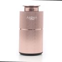 Rosé gouden, geribbelde Aroma diffuser op een witte achtergrond.