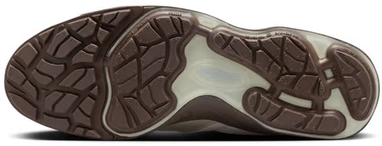 Onderkant van een bruine sneaker met een golvend profiel.