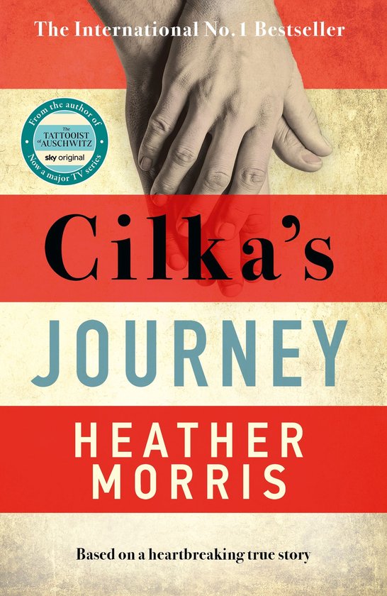 Boek "Cilka's Journey" van Heather Morris, met op de kaft twee handen en de tekst "The International No.1 Bestseller".