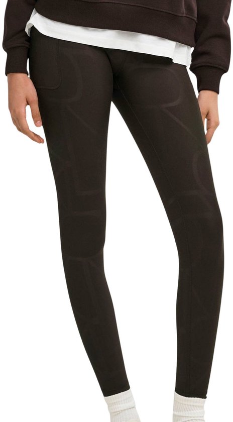 Legging vert foncé avec un motif logo subtil en relief et une poche latérale.