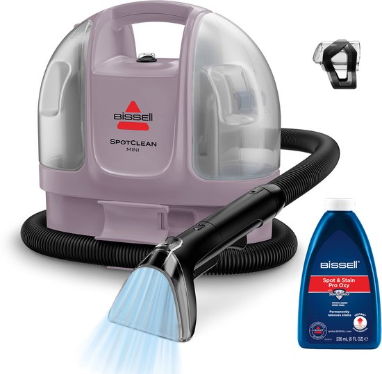 Roze BISSELL SpotClean Mini vlekkenreiniger met slang, mondstuk en reinigingsmiddel.