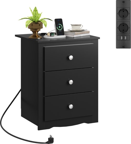 Zwart nachtkastje met 3 lades, bovenop een telefoon, smartwatch, plant en boek. Met oplaadstation met 2 stopcontacten en 2 USB-poorten.