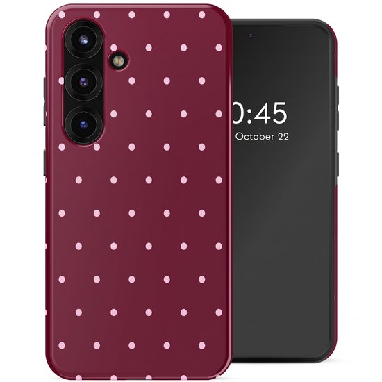 Coque de téléphone bordeaux à pois roses, à côté d'un smartphone.