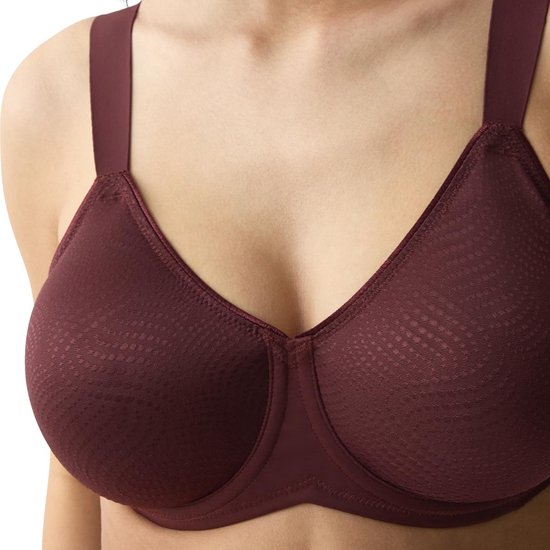 Close-up van een rode Triumph minimizer bh met textuur op de cups en verstelbare bandjes.