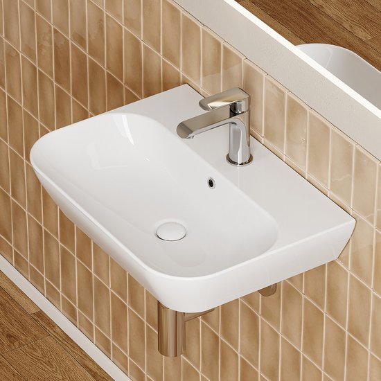 Lavabo blanc rectangulaire aux coins arrondis, monté sur un mur de carrelage brun.