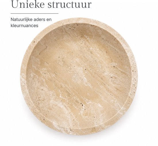 Ronde beige travertin schaal met natuurlijke aders.