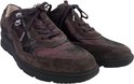 Paar bruine suède veterschoenen met ritsen en metallic accenten.