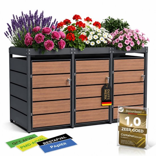 Grijze containerombouw met houtlook deuren, gevuld met bloeiende roze, witte en paarse bloemen. Drie afvalstickers zichtbaar.