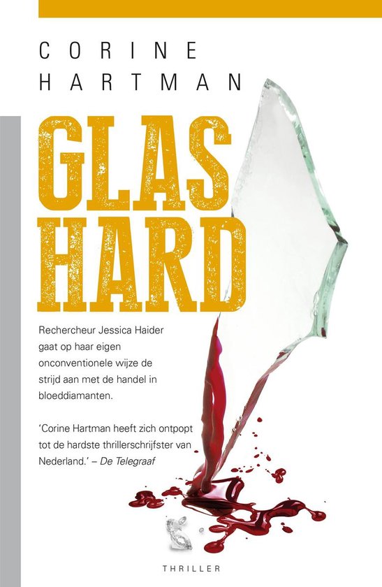 Boek 'Glas Hard' van Corine Hartman, met gebroken glas en bloeddruppels.