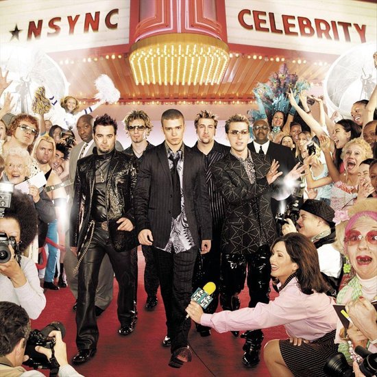 NSYNC op de rode loper bij de première van de film 'Celebrity', omringd door fans en fotografen.
