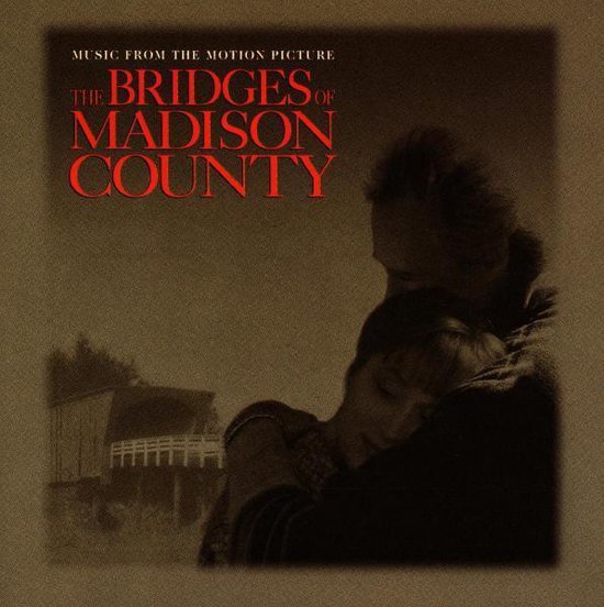 Albumcover met de titel 'The Bridges of Madison County' en een romantische scène van een koppel dat elkaar omhelst.