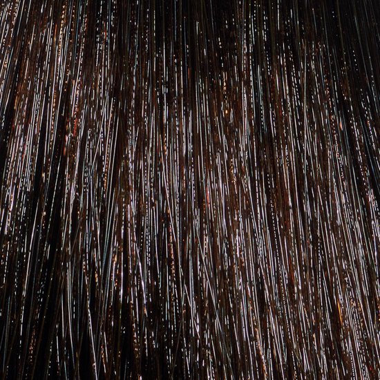 Structuur van bruin haar met gouden highlights.