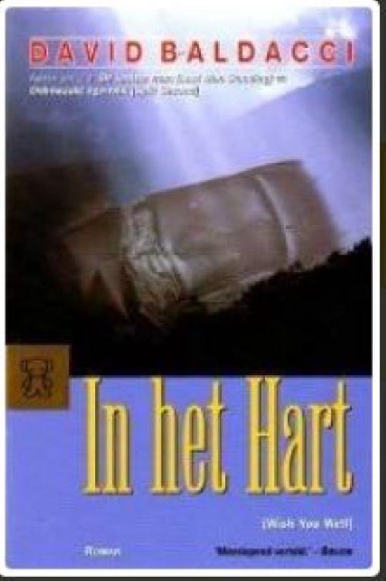 Boekcover van 'In het Hart' van David Baldacci. Toont een wazige afbeelding van een voertuig en de titel.