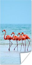 Poster Vier flamingo's staan op het strand - 40x80 cm