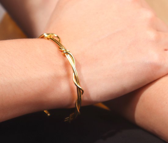 Superbe bracelet torsadé en argent plaqué or