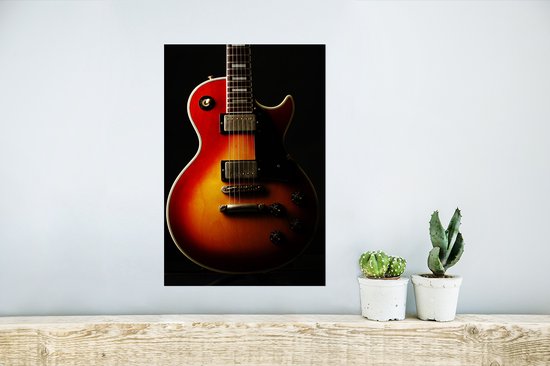Poster 20x30 cm - Een roodkleurige elektrische gitaar - Posters - Kamer decoratie - Wanddecoratie woonkamer - Muurdecoratie slaapkamer