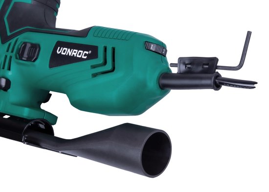 Detail van de groene en zwarte VONROC decoupeerzaag met instelknop en zeskantsleutel.