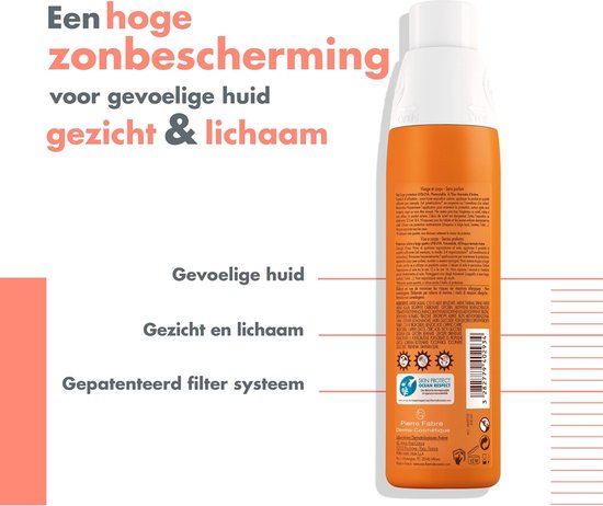 Achterkant van oranje Avène spuitfles met teksten over bescherming voor gezicht en lichaam.