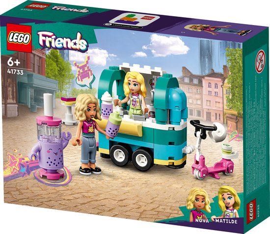 Doos met LEGO Friends mobiele bubbelthee stand: twee poppen, een mintgroene en gele foodtruck, een paarse bubbelthee-automaat en een roze scooter.