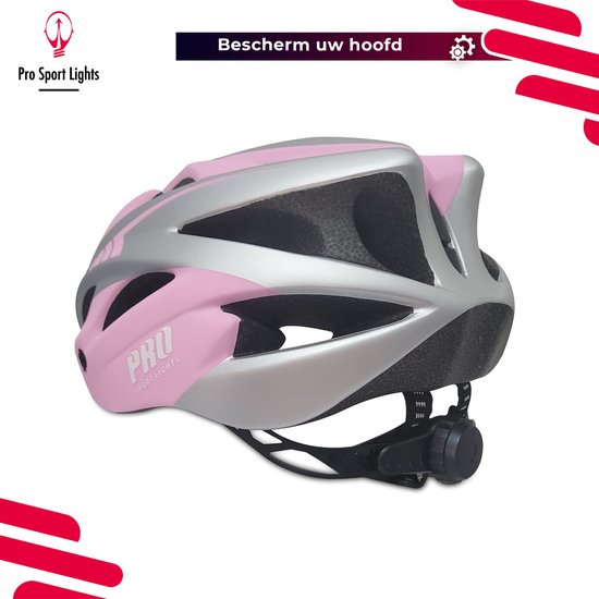Roze fietshelm met zilveren accenten en ventilatie, 'PRO SPORT LIGHTS' logo.