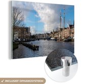MuchoWow® Glasschilderij 60x40 cm - Schilderij acrylglas - Brug - Haarlem - Centrum - Foto op glas - Schilderijen