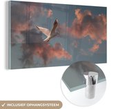 MuchoWow® Glasschilderij 120x60 cm - Schilderij acrylglas - Meeuw - Zon - Wolken - Foto op glas - Schilderijen