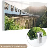 MuchoWow® Glasschilderij 40x20 cm - Schilderij acrylglas - Een trein over een brug - Foto op glas - Schilderijen