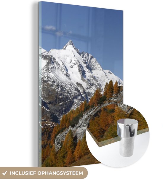 MuchoWow® Glasschilderij 100x150 cm - Schilderij acrylglas - De hoogste berg tijdens de herfst in het Park Hohe Tauern in Oostenrijk - Foto op glas - Schilderijen