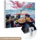 MuchoWow® Glasschilderij - Uitzicht op een bloesemboom vanaf een tafel met gerechten uit de Japanse keuken - 120x80 cm - Acrylglas Schilderijen - Foto op Glas