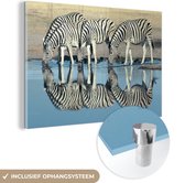MuchoWow® Glasschilderij 60x40 cm - Schilderij acrylglas - Zebra's drinken - Foto op glas - Schilderijen