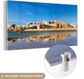 MuchoWow® Glasschilderij 160x80 cm - Schilderij acrylglas - Panorama van de Marokkaanse stad Rabat - Foto op glas - Schilderijen