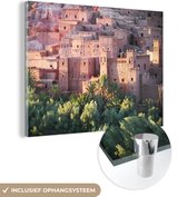 MuchoWow® Glasschilderij 80x60 cm - Schilderij acrylglas - Architectuur van Aït-Benhaddou bij zonsondergang in Marokko - Foto op glas - Schilderijen