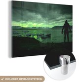 MuchoWow® Glasschilderij 90x60 cm - Schilderij acrylglas - Noorderlicht - Natuur - Man - IJsland - Foto op glas - Schilderijen