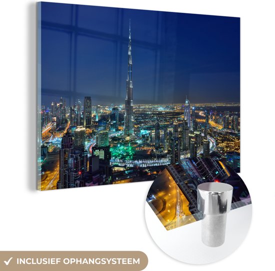 MuchoWow® Glasschilderij 90x60 cm - Schilderij acrylglas - Dubai en de Burj Khalifa verlicht in de avond - Foto op glas - Schilderijen