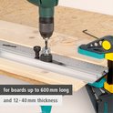 Wolfcraft deuvelmal met boor, tekst: 'for boards up to 600 mm long' en 'and 12-40 mm thickness'.