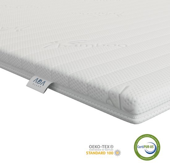 Dessus de lit blanc à rayures avec étiquette ADA SLEEP. Certifié Oeko-Tex et CertiPUR-US.
