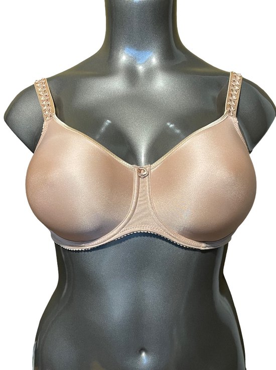 Nude balconnetbeha op een mannequin, met versierde bandjes en kanten rand.