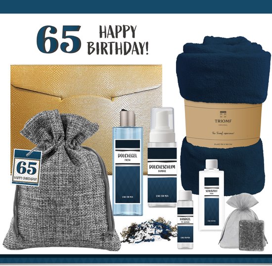 Gouden cadeauverpakking, grijze linnen zak met verzorgingsproducten en een donkerblauwe plaid van Triomf.